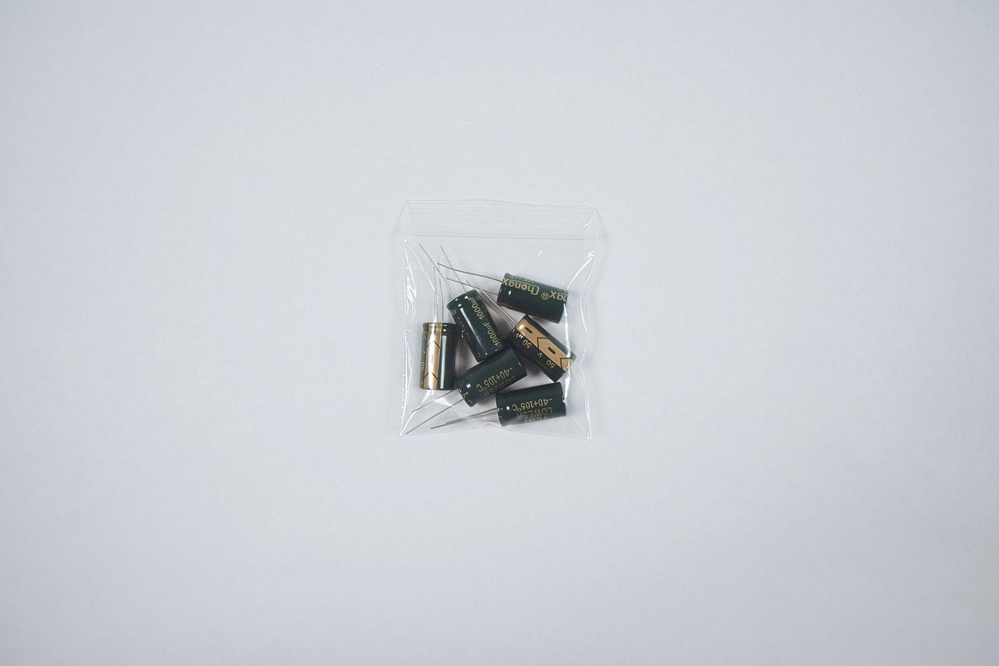 50v 1000uf capacitors in a bag on a white background