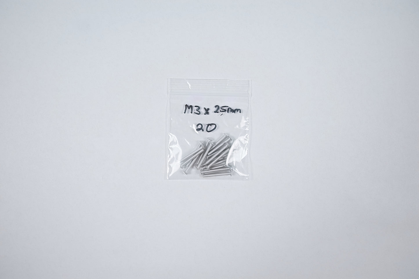 aluminum screws in a bag on a white background