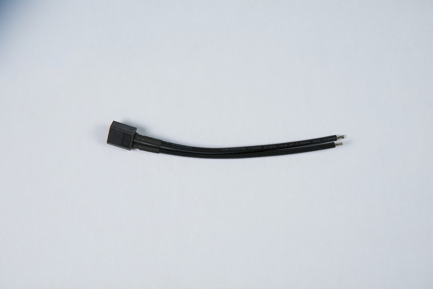 black wire connector on a white background