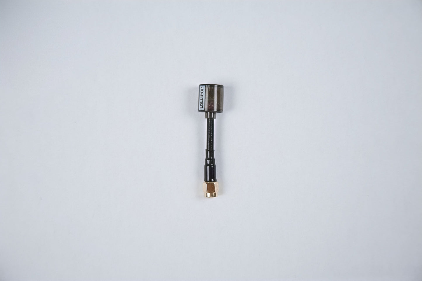 fpv lollipop v5 antenna outside of its packaging on a white background