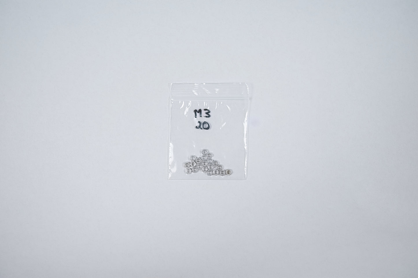 aluminum m3 nuts in a bag on a white background