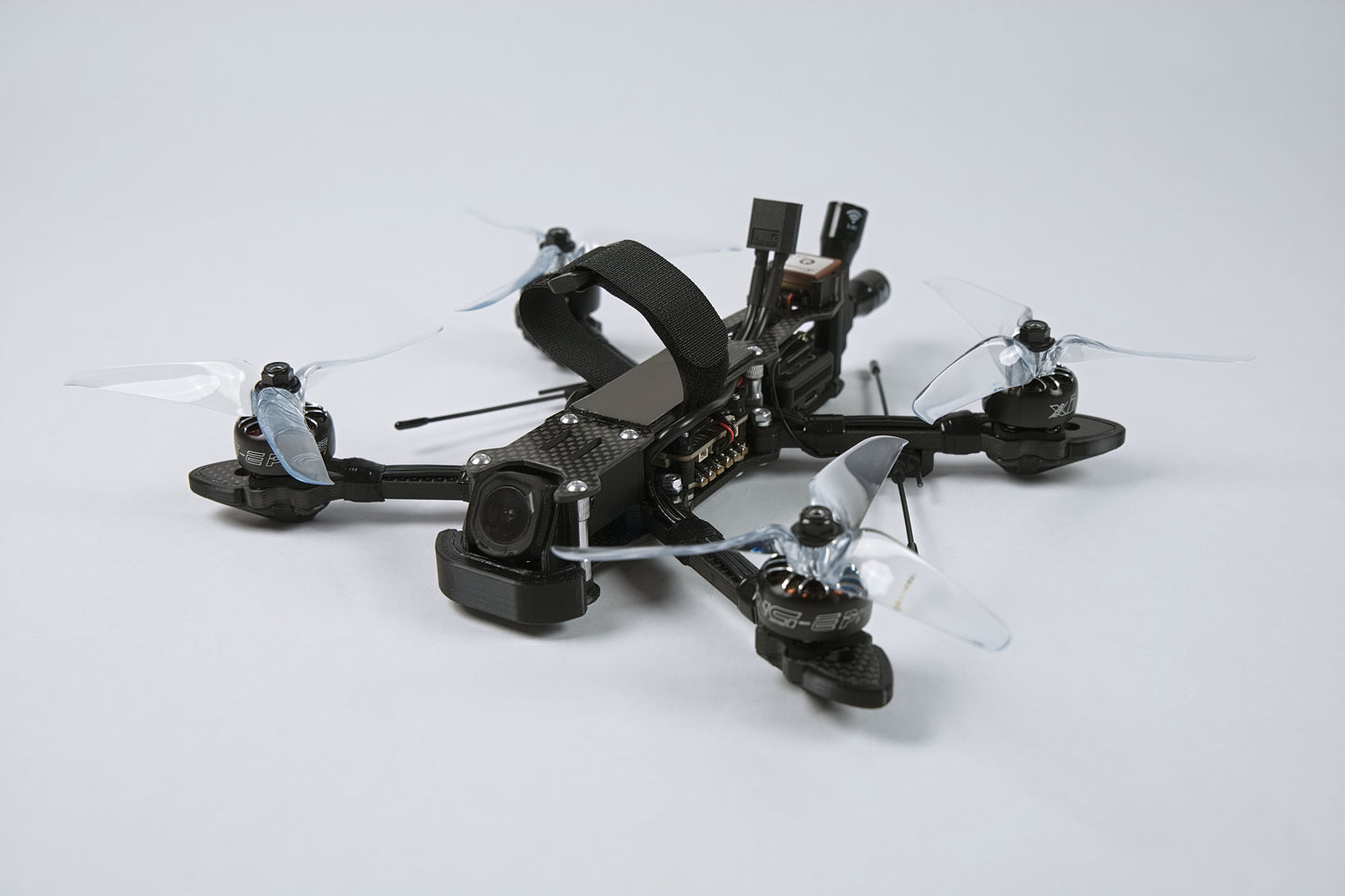 photo of a fpv drone from the front with a white background