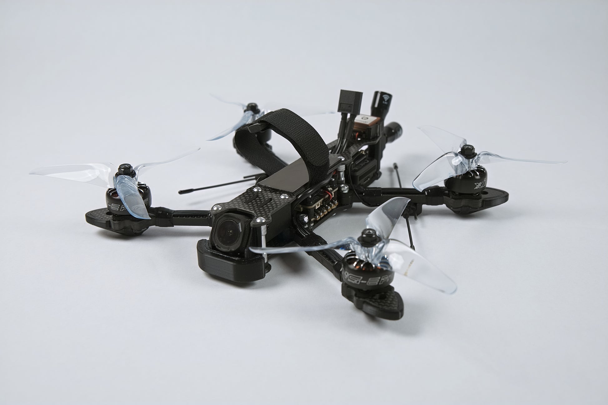 photo of a fpv drone from the front with a white background