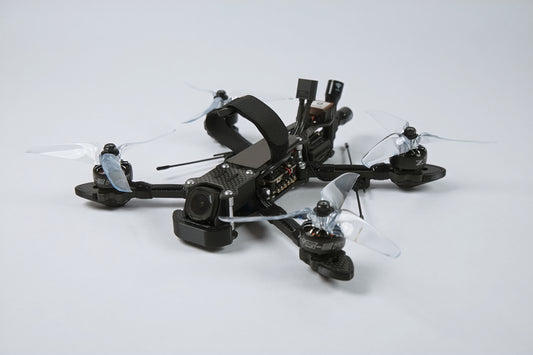 photo of a fpv drone from the front with a white background