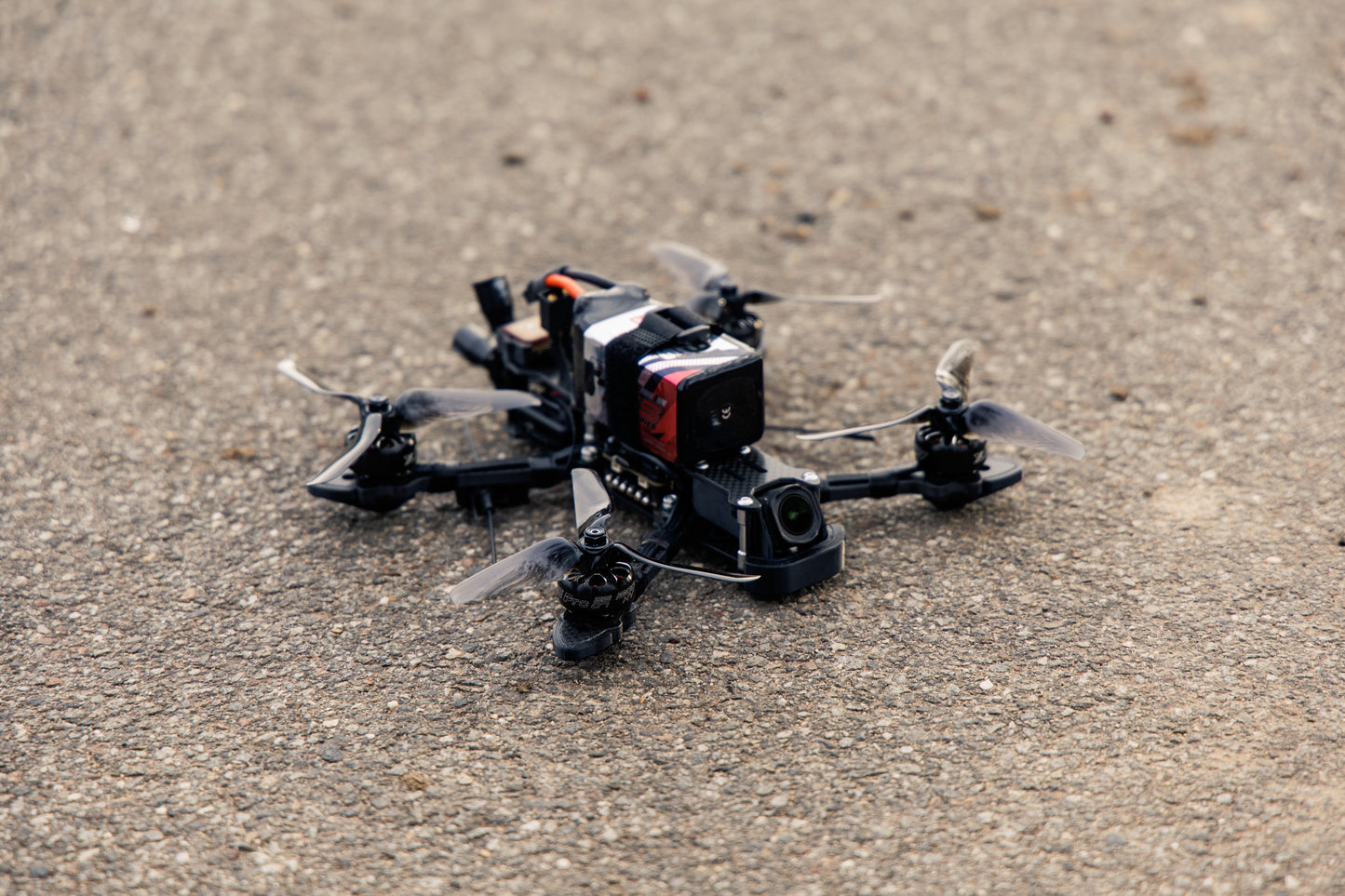 photo of a fpv drone outdoors on a beige background