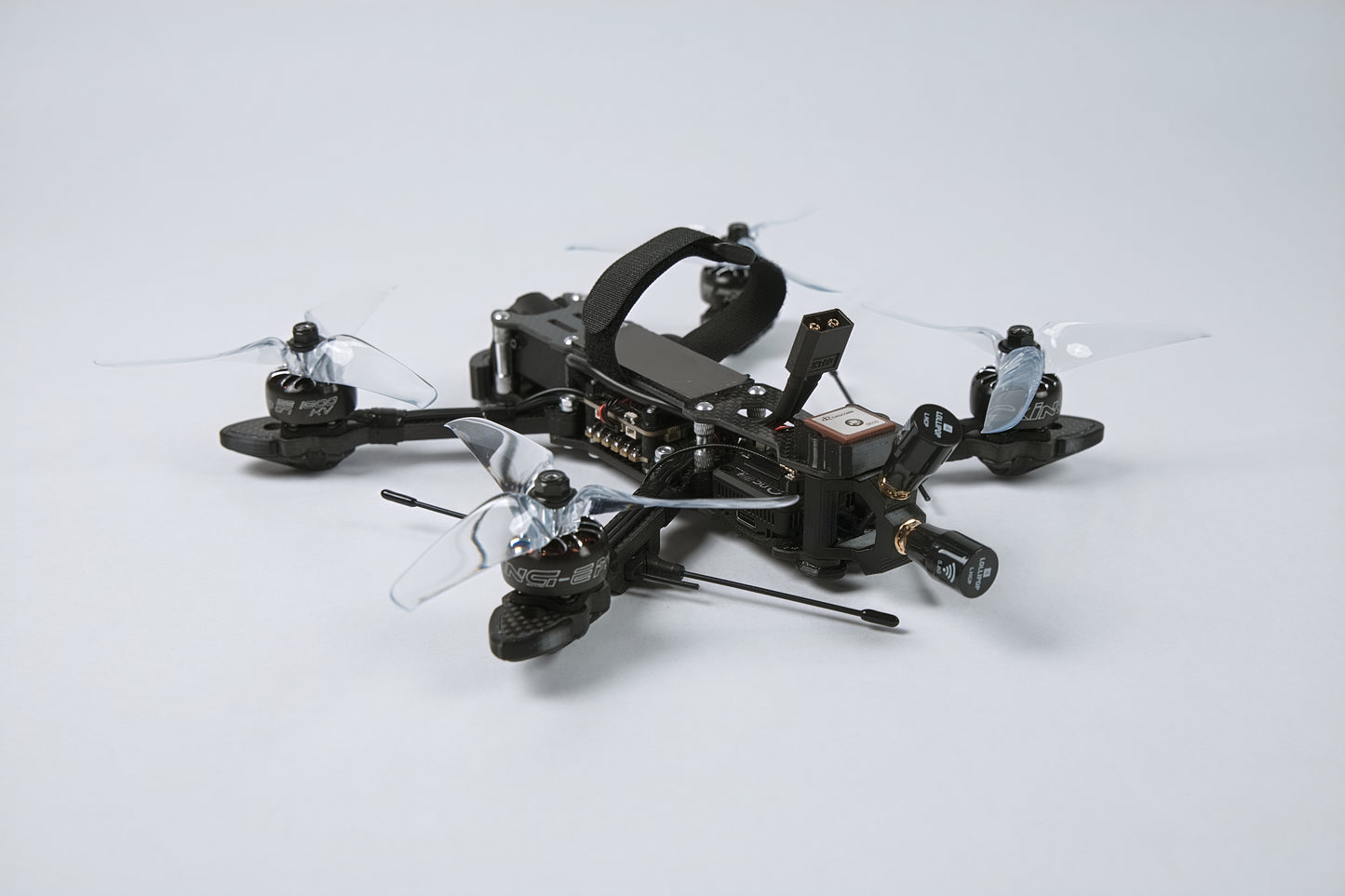 photo of a fpv drone from the back with a white background