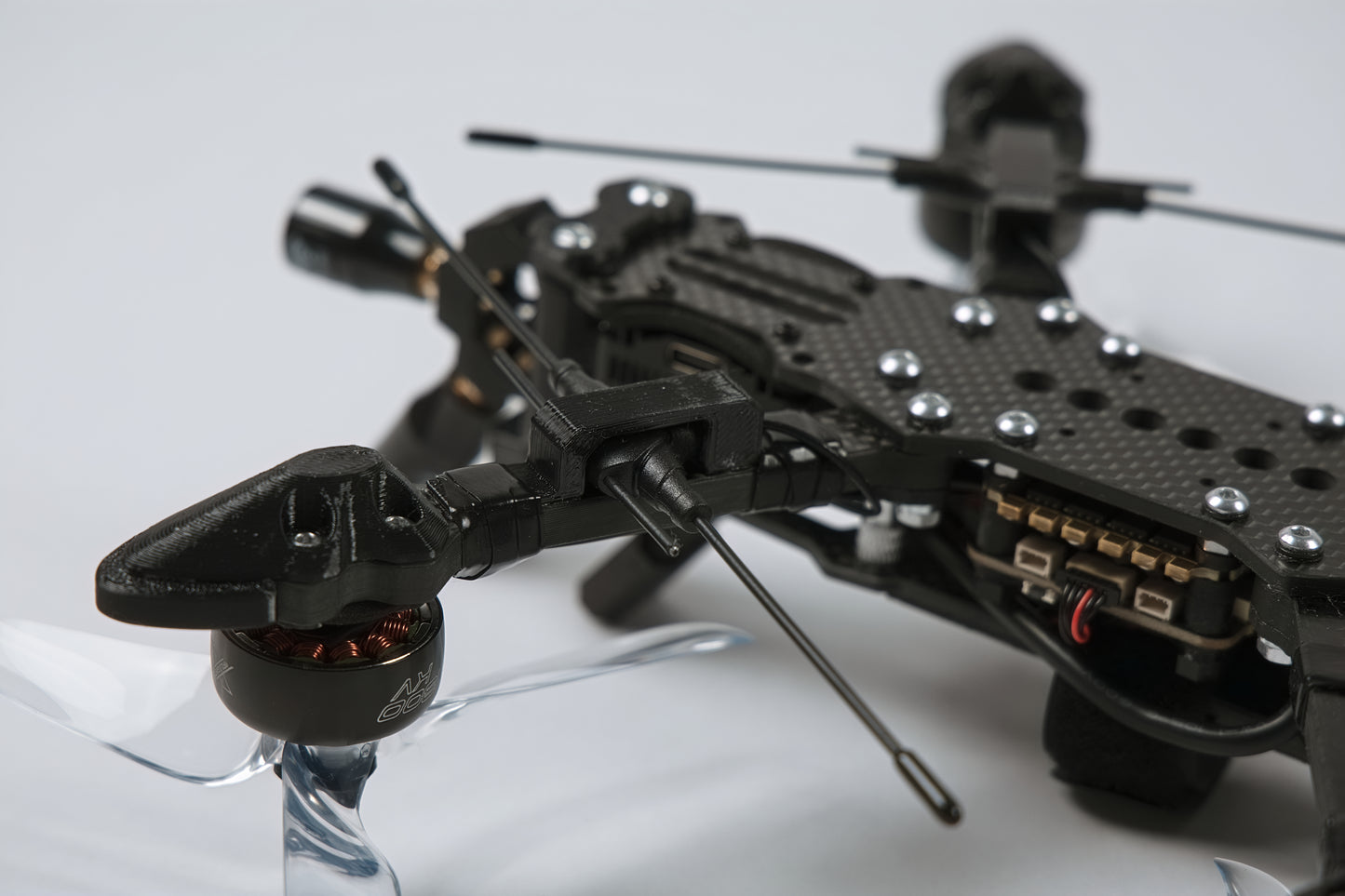 photo of fpv drone from the back upside down with a white background 