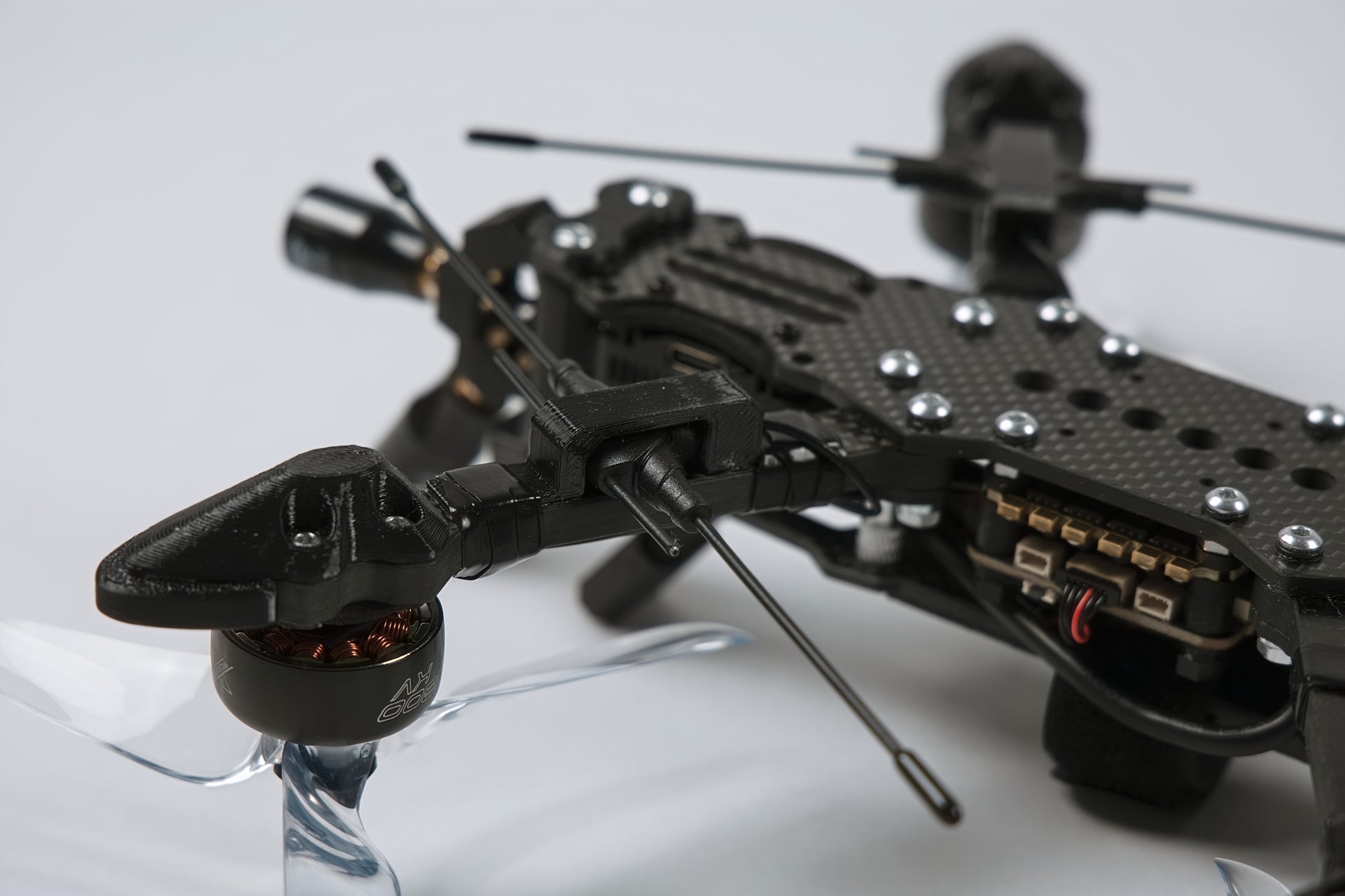 photo of fpv drone from the back upside down with a white background 