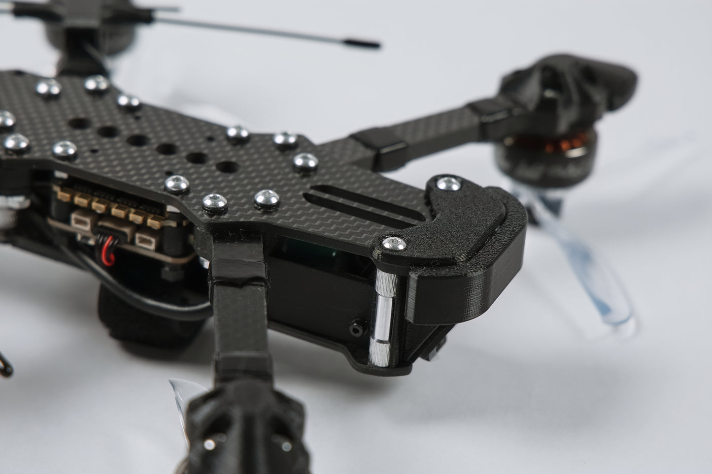 photo of fpv drone from the front upside down with a white background