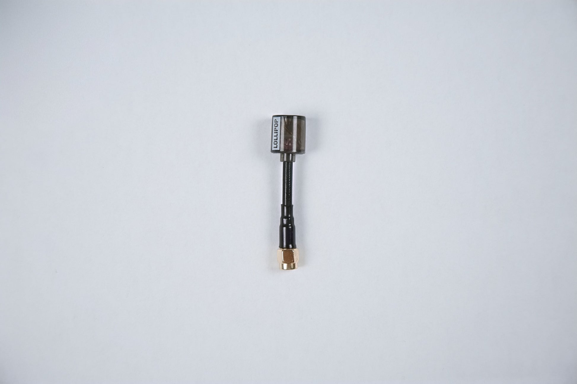 fpv lollipop v5 antenna outside of its packaging on a white background