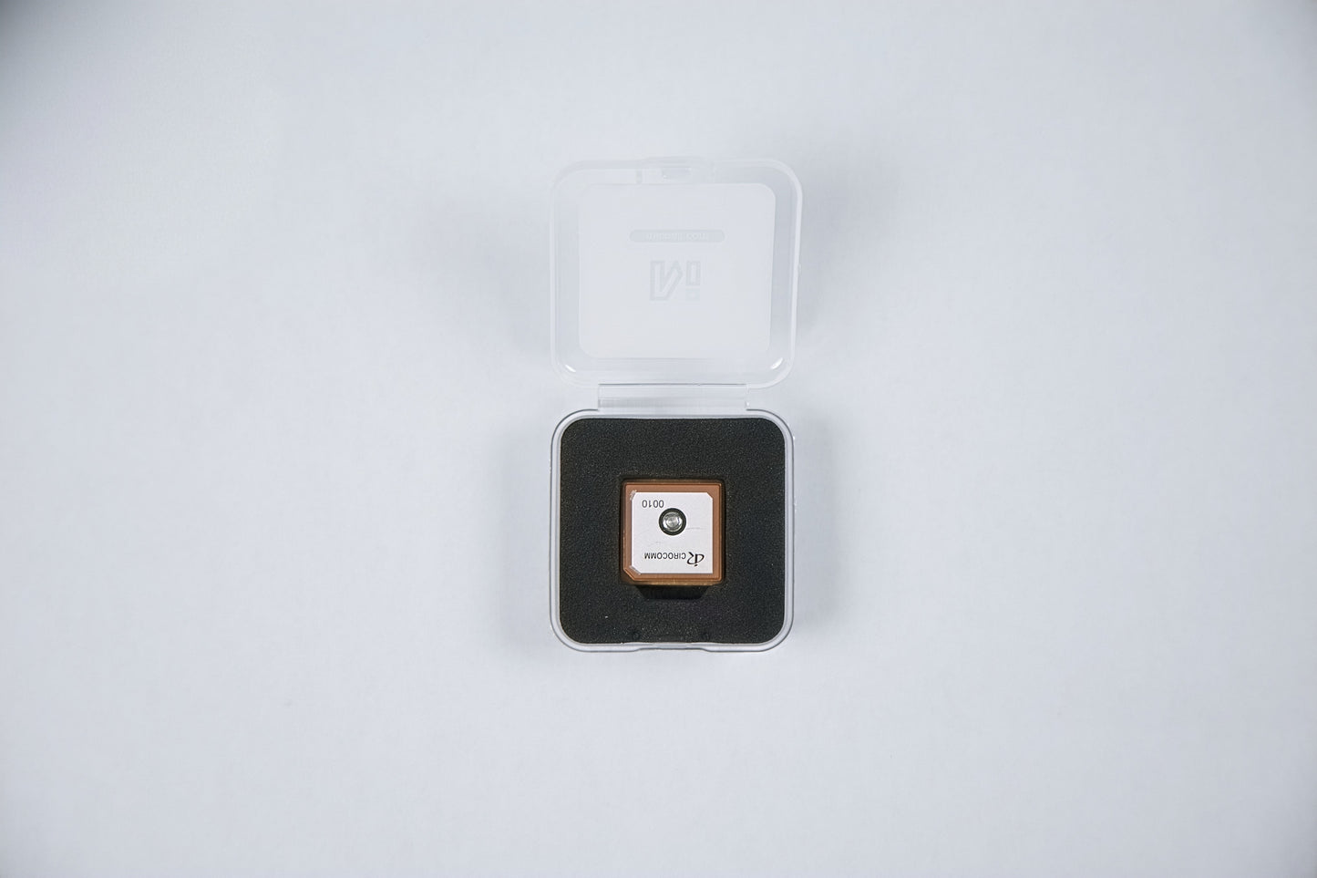 fpv m10 5883 gps module package opened with a logo on a white background