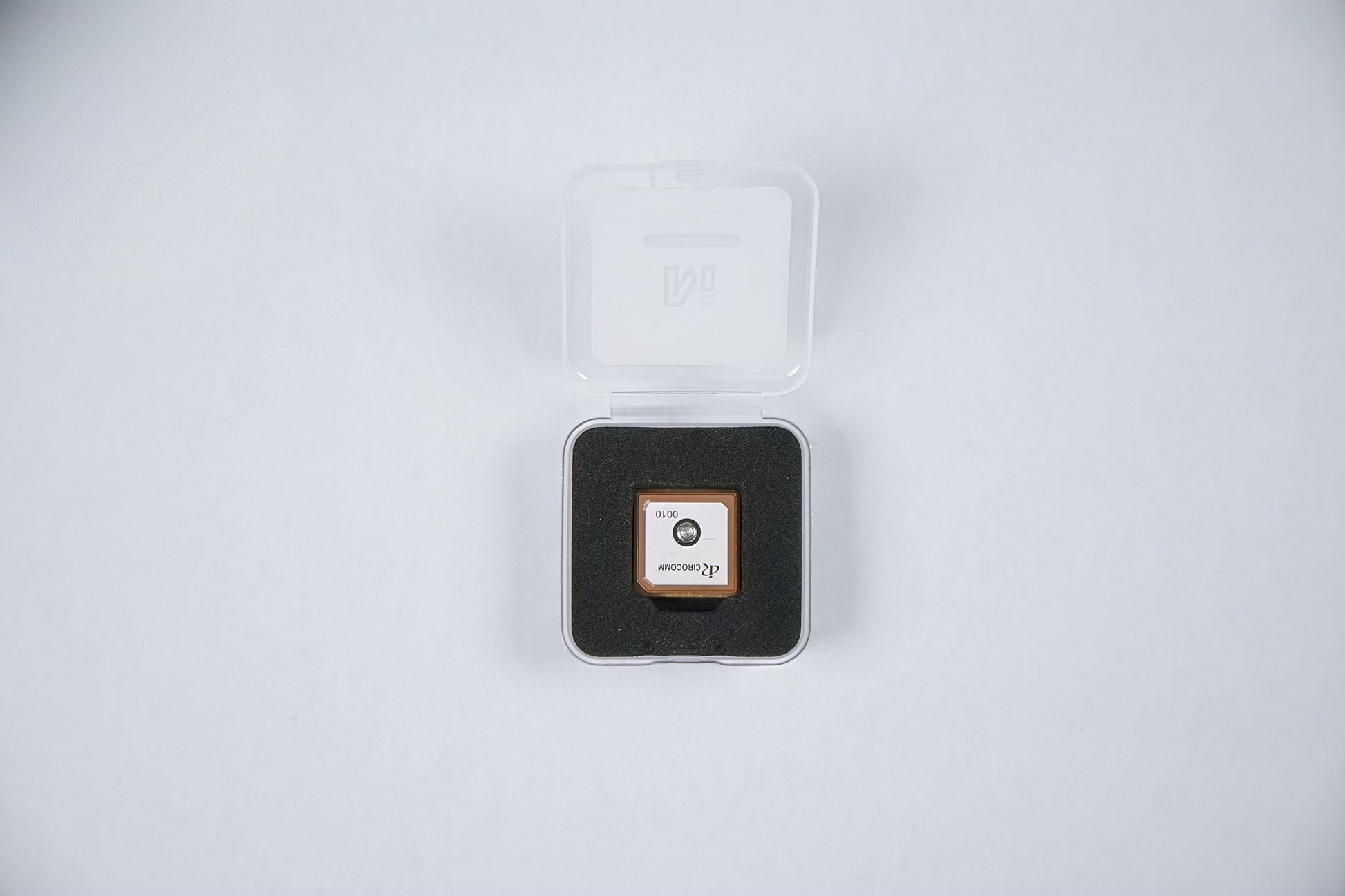 fpv m10 5883 gps module package opened with a logo on a white background