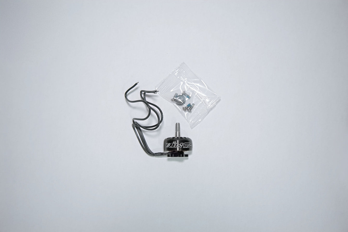 fpv xing e pro motor unpackaged on a white background