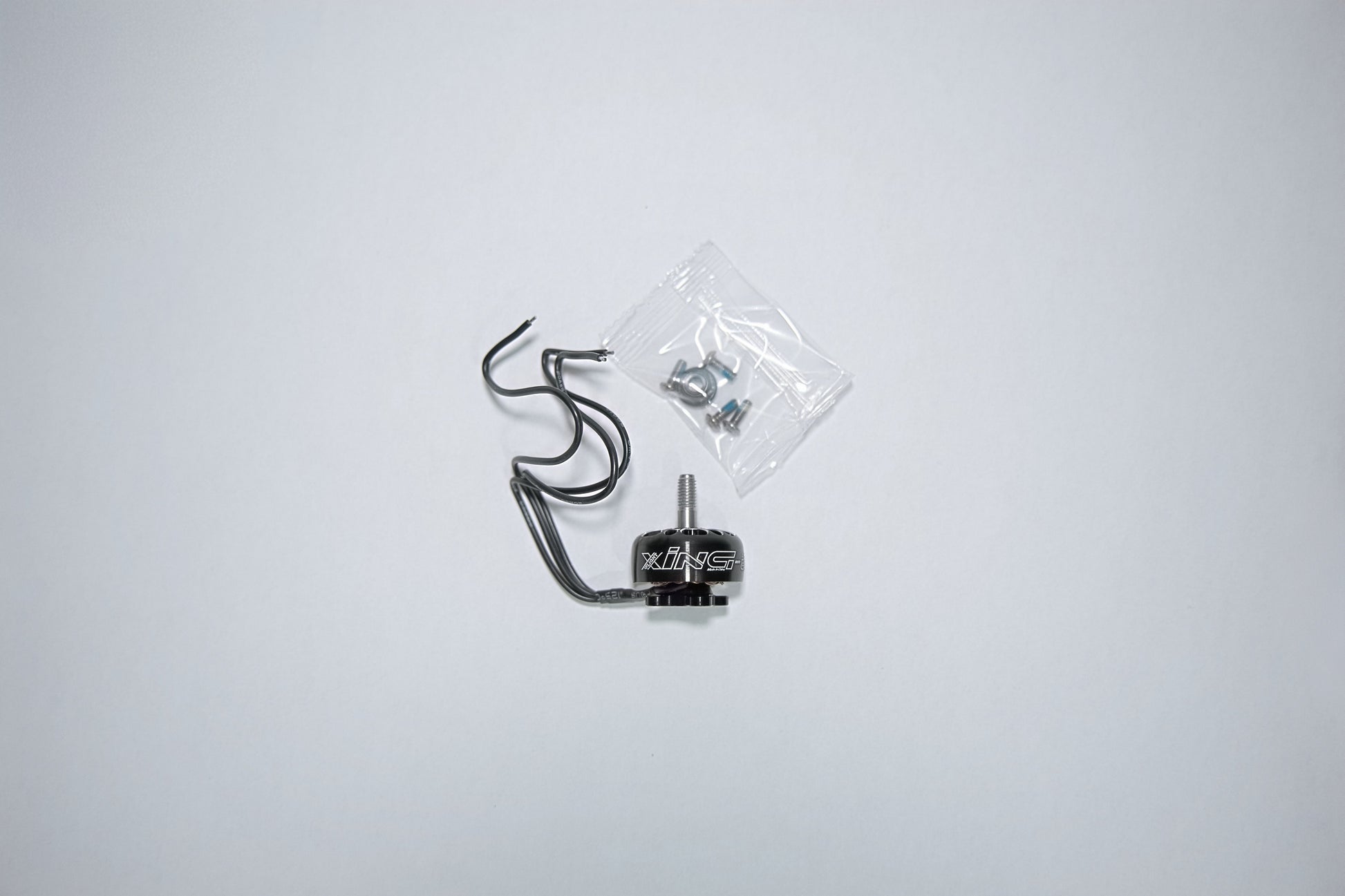 fpv xing e pro motor unpackaged on a white background