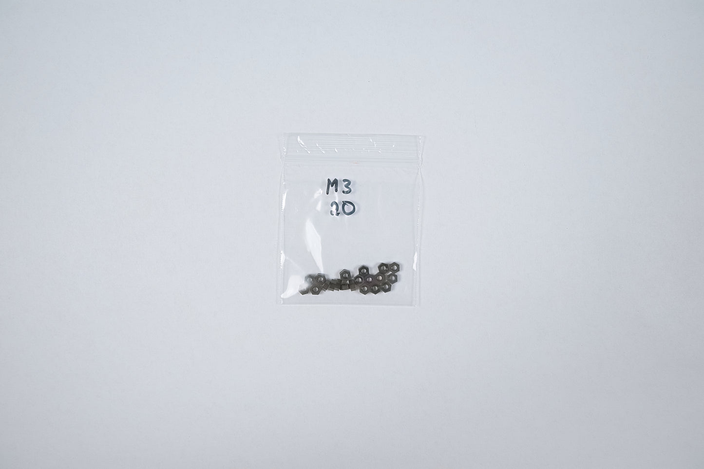 plastic nuts in a bag on a white background