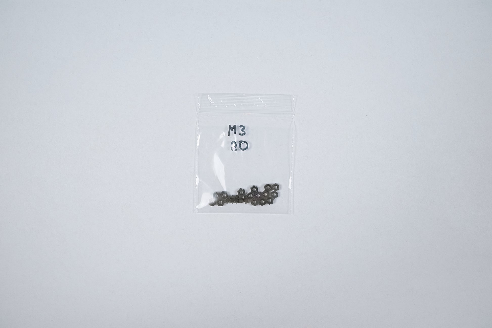 plastic nuts in a bag on a white background
